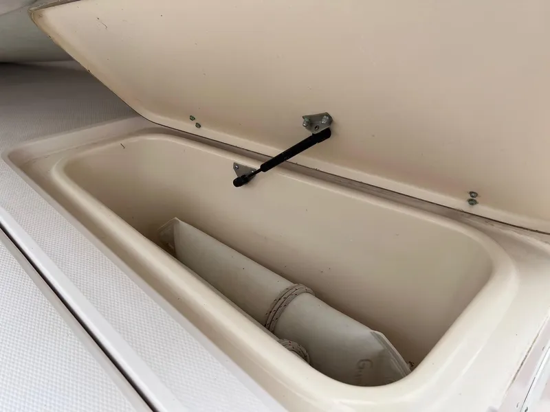 Slide: The Image of Open storage compartment on a 1999 Grady-White 222 boat. - 23
