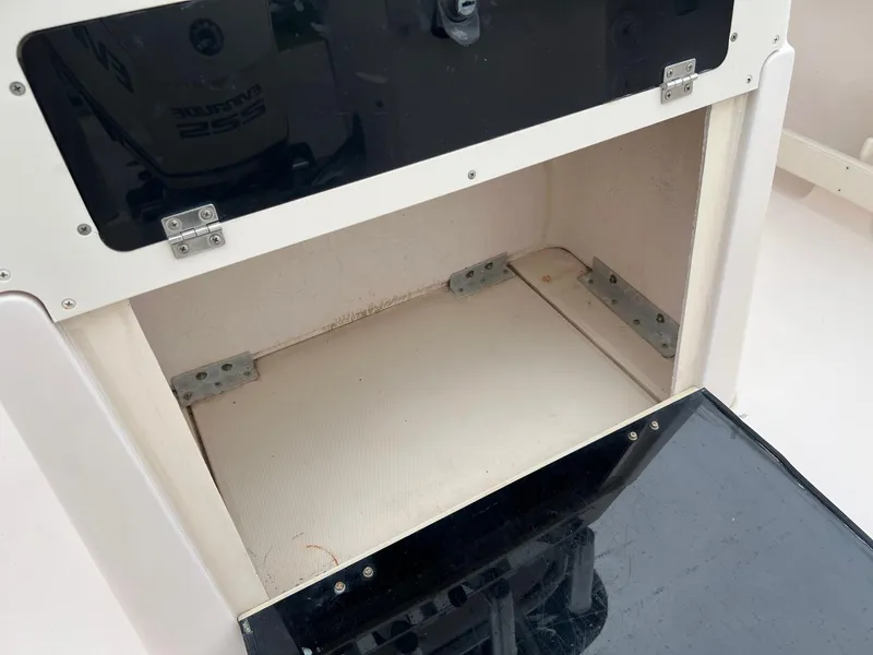 Slide: The Image of Open storage compartment on a 1999 Grady-White 222 boat. - 25
