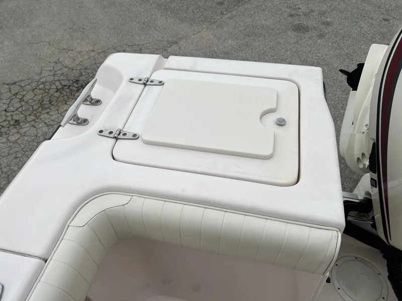 Slide: The Image of 1999 Grady-White 222 boat deck with storage compartment and seating. - 6