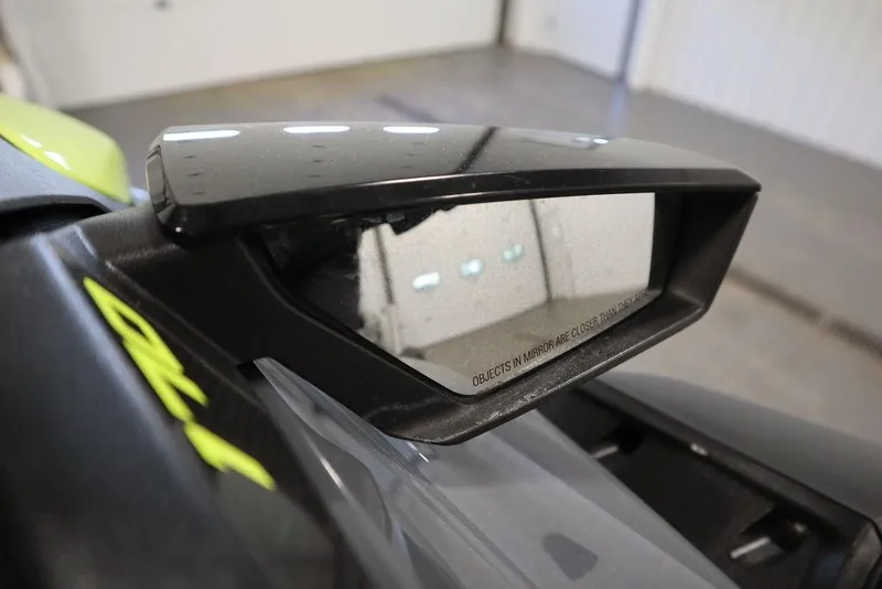 Slide: The Image of 2022 Sea-Doo GTI SE 170 SS side mirror in a garage setting. - 14