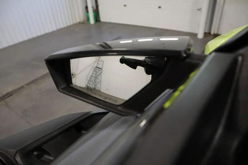 Slide: The Image of Side mirror of 2022 Sea-Doo GTI SE 170 SS in a garage setting. - 15