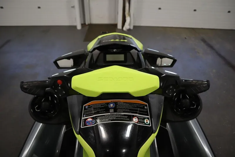 Slide: The Image of 2022 Sea-Doo GTI SE 170 SS dashboard and controls in a garage setting. - 16