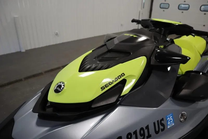 Slide: The Image of 2022 Sea-Doo GTI SE 170 SS jet ski in a garage setting. - 18