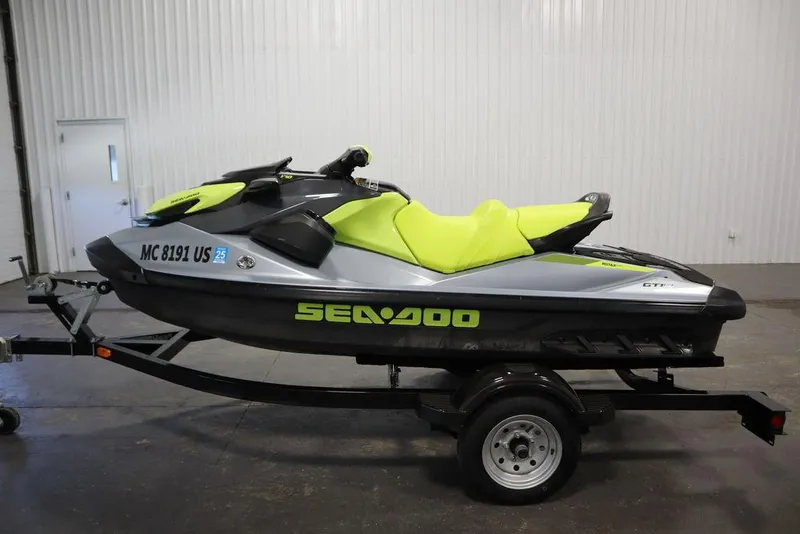 Slide: The Image of 2022 Sea-Doo GTI SE 170 SS jet ski on trailer, lime green and black design. - 19