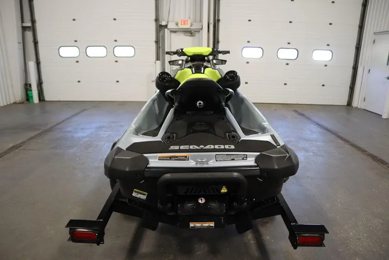 Slide: The Image of 2022 Sea-Doo GTI SE 170 SS jet ski in a garage, rear view. - 21