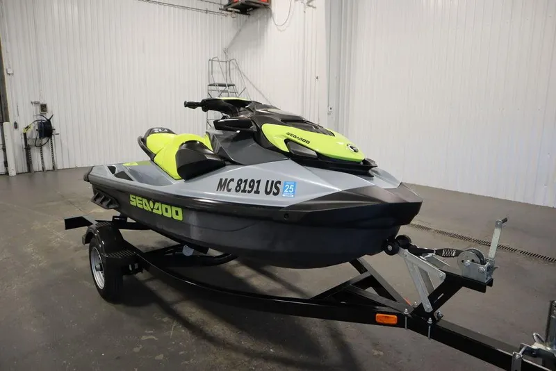 Slide: The Image of 2022 Sea-Doo GTI SE 170 SS jet ski on trailer in indoor setting. - 24