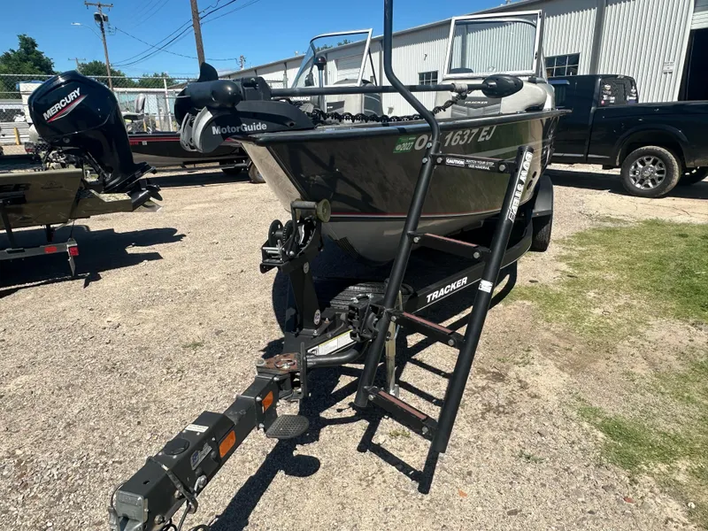 Slide: The Image of 2018 Tracker Targa V-19 WT 40th Anniversary Edition boat on trailer in outdoor setting. - 16