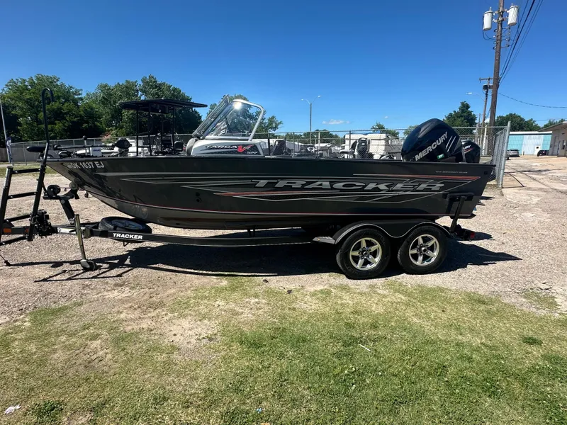 Slide: The Image of 2018 Tracker Targa V-19 WT 40th Anniversary Edition boat on trailer, outdoors. - 4