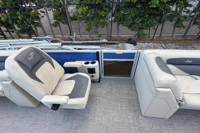 Slide: The Image of 2023 Barletta ARIA 22QC boat interior with plush seating and cup holders. - 37
