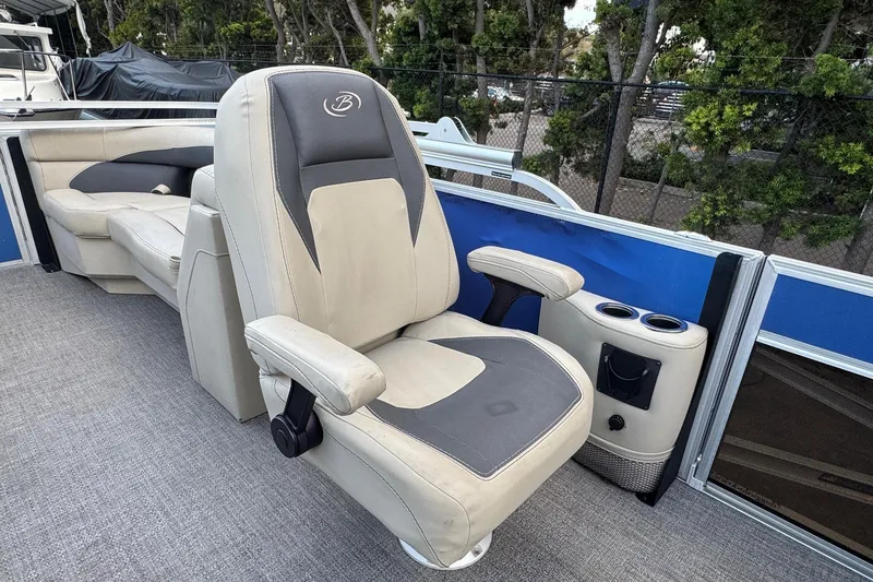 Slide: The Image of 2023 Barletta ARIA 22QC boat interior with plush seating and cup holders. - 41