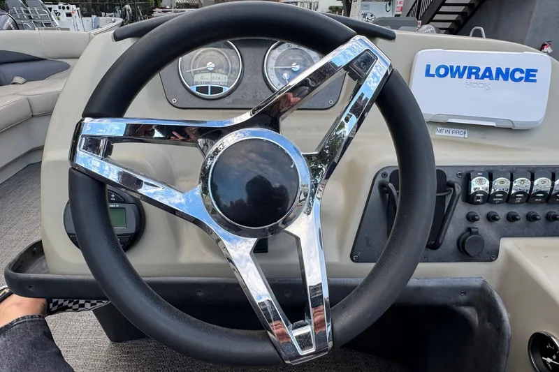 Slide: The Image of Steering wheel of 2023 Barletta ARIA 22QC boat with Lowrance navigation system. - 44