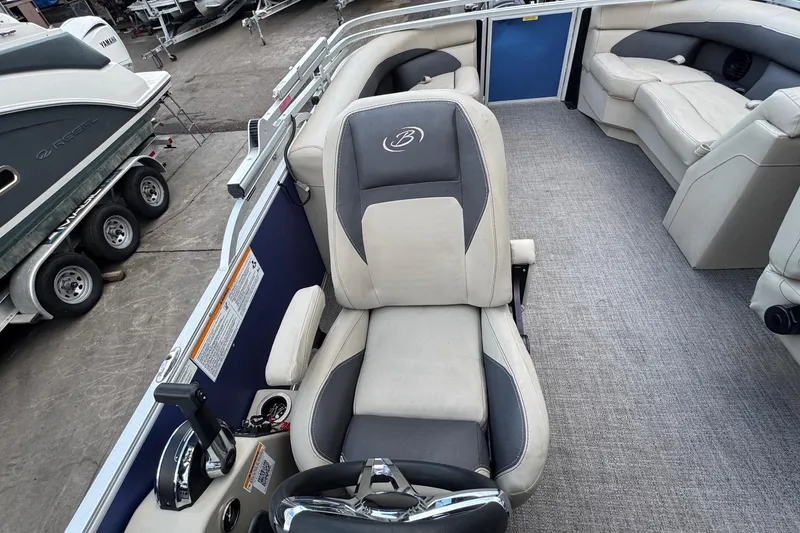 Slide: The Image of 2023 Barletta ARIA 22QC pontoon boat interior with captain's chair and seating area. - 50