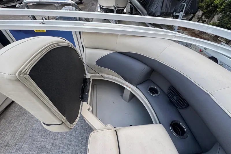Slide: The Image of 2023 Barletta ARIA 22QC pontoon boat interior with seating and cup holders. - 58