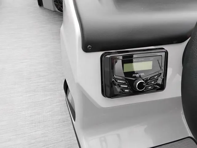 Slide: The Image of 2025 Lowe LS 190 boat dashboard with Kicker audio system. - 10