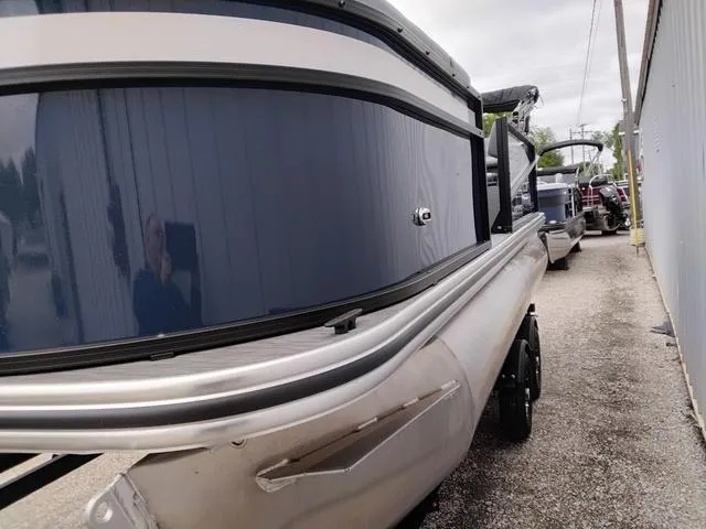 Slide: The Image of 2025 Lowe LS 190 boat, sleek design, parked outdoors near a building. - 12