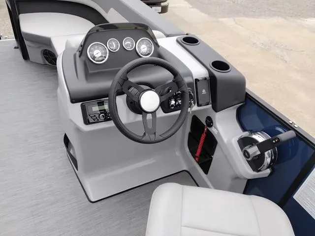 Slide: The Image of 2025 Lowe LS 190 boat dashboard with steering wheel and control panel. - 6