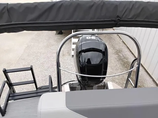 Slide: The Image of 2025 Lowe LS 190 boat with outboard motor and ladder, viewed from above. - 8