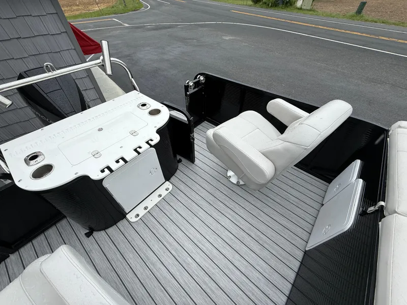 Slide: The Image of 2020 Avalon 2585 Catalina boat interior with seating and fishing station on a tri-toon deck. - 12