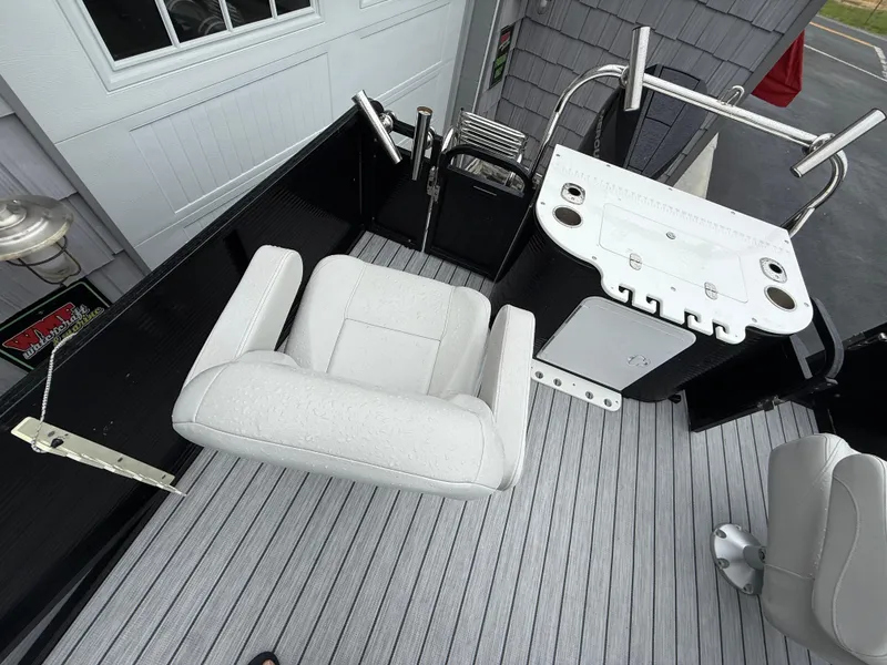 Slide: The Image of 2020 Avalon 2585 Catalina boat interior with fishing seat and control panel. - 13