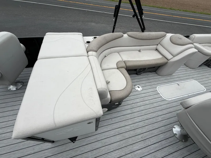 Slide: The Image of 2020 Avalon 2585 Catalina Tri-toon boat with plush seating and spacious deck layout. - 14