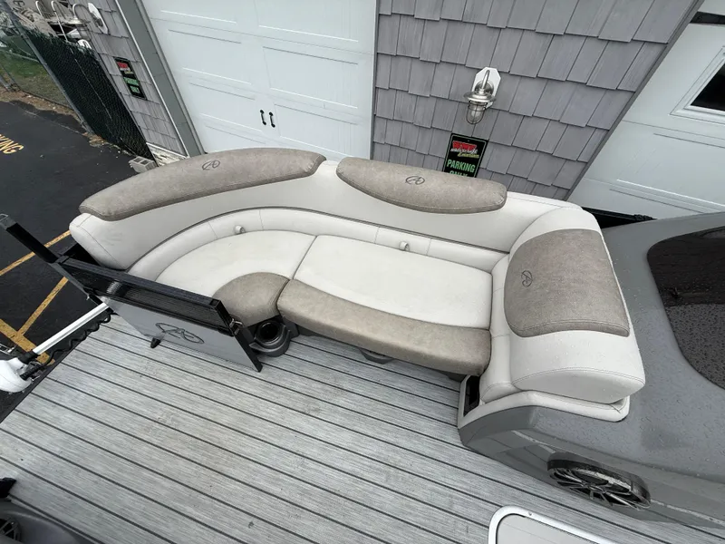 Slide: The Image of 2020 Avalon 2585 Catalina boat with beige seating on a gray deck. - 15