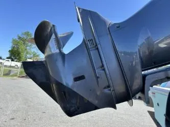 Slide: The Image of Outboard motor of 2008 Chris-Craft Catalina 26 against a clear blue sky. - 13