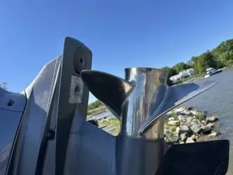 Slide: The Image of Close-up of a 2008 Chris-Craft Catalina 26 boat propeller by the water. - 14