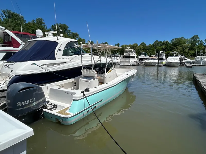 Slide: The Image of 2008 Chris-Craft Catalina 26 boat docked in a marina with Yamaha outboard motor. - 4