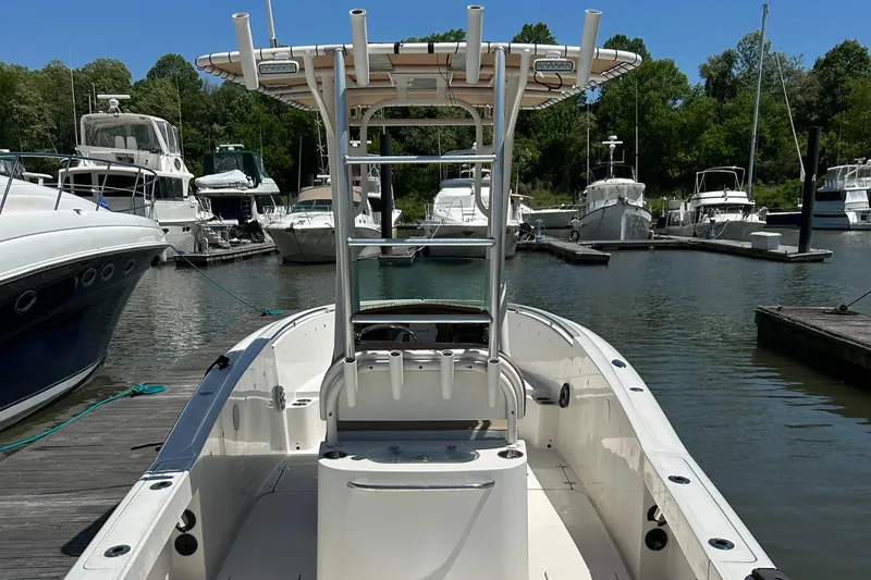 Slide: The Image of 2008 Chris-Craft Catalina 26 boat docked in a marina with other vessels. - 5