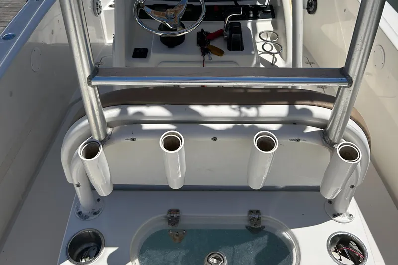 Slide: The Image of 2008 Chris-Craft Catalina 26 boat cockpit with rod holders and steering console. - 8