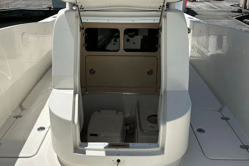Slide: The Image of 2008 Chris-Craft Catalina 26 boat interior with open storage compartment. - 9