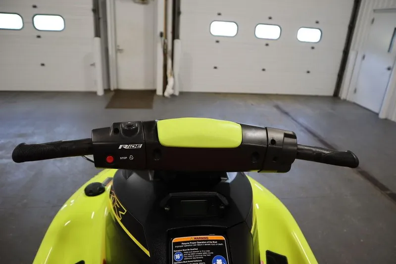 Slide: The Image of 2021 Yamaha WaveRunner EXR® handlebars in a garage setting. - 11
