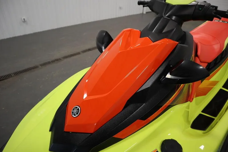 Slide: The Image of 2021 Yamaha WaveRunner EXR® in vibrant red and yellow, showcasing sleek design and handlebars. - 12