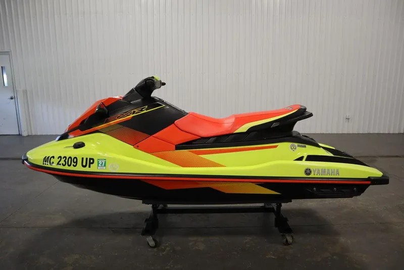 Slide: The Image of 2021 Yamaha WaveRunner EXR® in vibrant yellow and red, displayed indoors. - 14