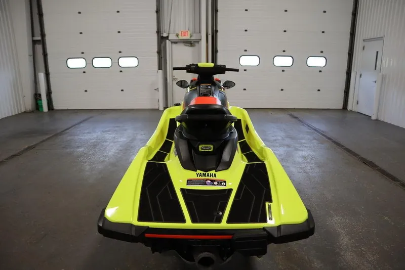 Slide: The Image of 2021 Yamaha WaveRunner EXR® in a garage, rear view, vibrant yellow and black design. - 15