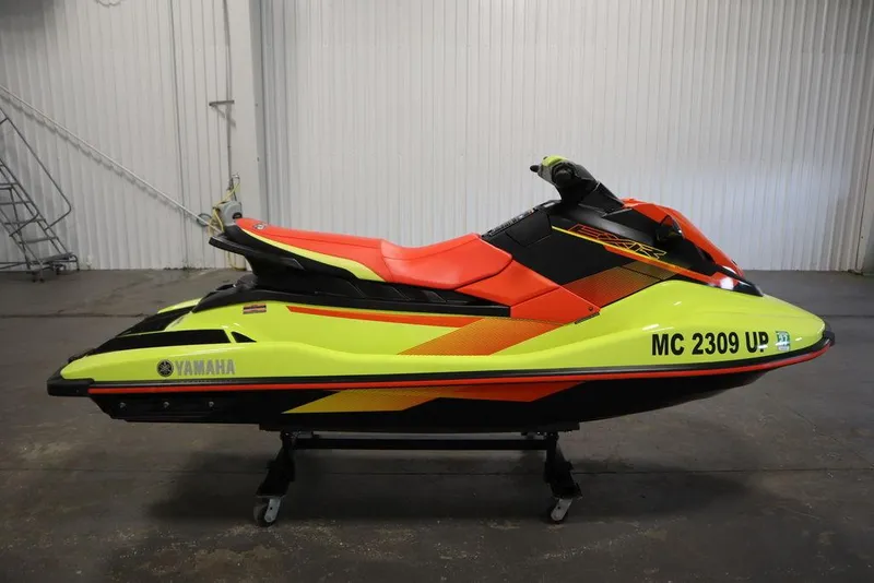 Slide: The Image of 2021 Yamaha WaveRunner EXR® in vibrant yellow and red, displayed indoors. - 18