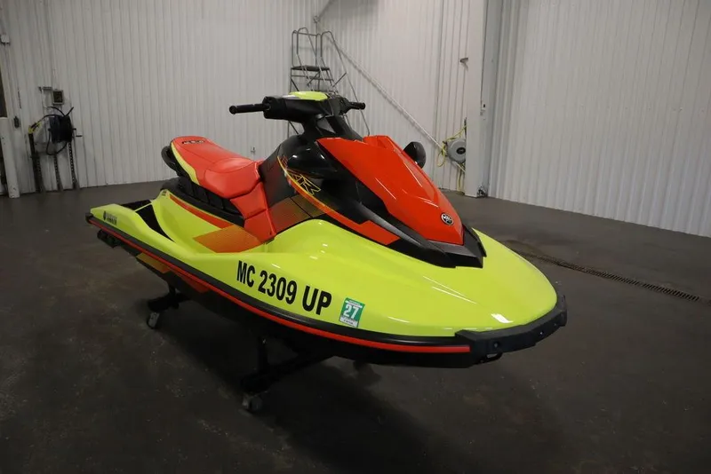 Slide: The Image of 2021 Yamaha WaveRunner EXR® in a garage, featuring vibrant yellow and red colors. - 19