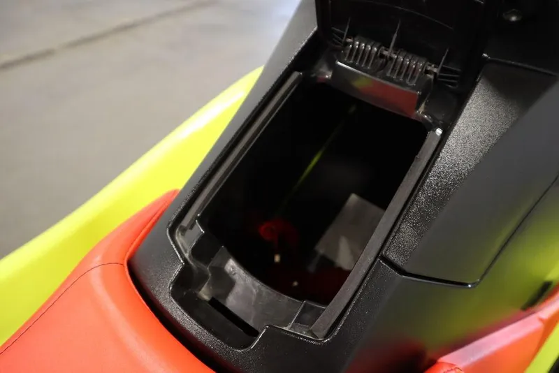 Slide: The Image of 2021 Yamaha WaveRunner EXR® storage compartment, featuring vibrant red and yellow design. - 2