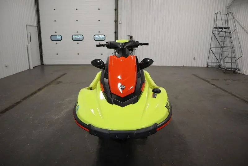 Slide: The Image of 2021 Yamaha WaveRunner EXR® in a garage, front view, vibrant yellow and orange design. - 20