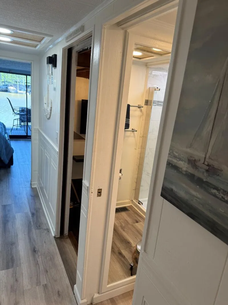 Slide: The Image of Interior of 1986 Stardust Cruisers 18 X 80 Houseboat with hallway and bathroom view. - 21