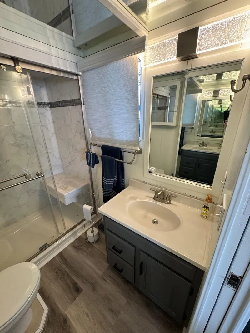 Slide: The Image of Bathroom interior of 1986 Stardust Cruisers 18 X 80 Houseboat with modern fixtures. - 42