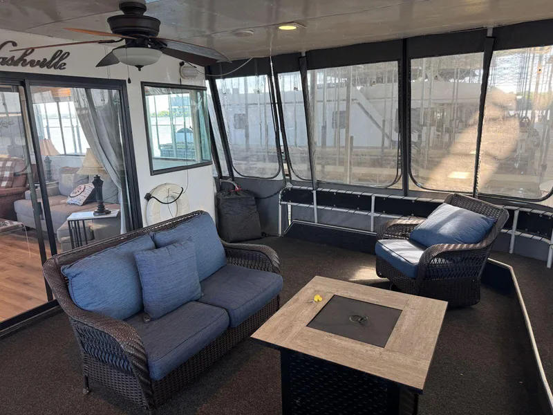Slide: The Image of 1986 Stardust Cruisers 18 X 80 houseboat interior with cozy seating and modern decor. - 6