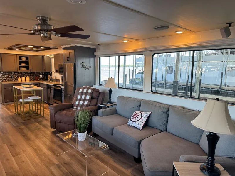 Slide: The Image of Interior of 1986 Stardust Cruisers 18 X 80 houseboat with modern furnishings and large windows. - 9