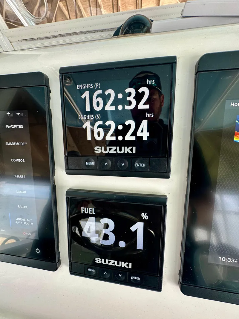 Slide: The Image of Dashboard of a 2021 Albury Brothers 27 boat showing engine hours and fuel level. - 15