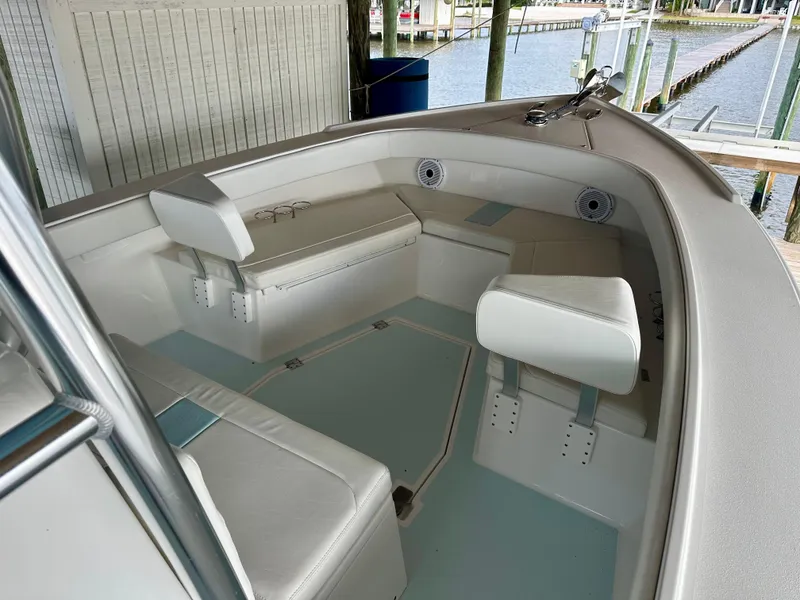 Slide: The Image of 2021 Albury Brothers 27 boat interior with white seating and waterfront view. - 16
