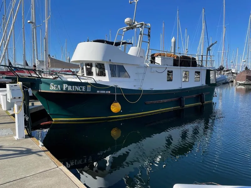 The Image of Custom 2010 trawler "Sea Prince III" docked at marina, clear blue sky. - 1