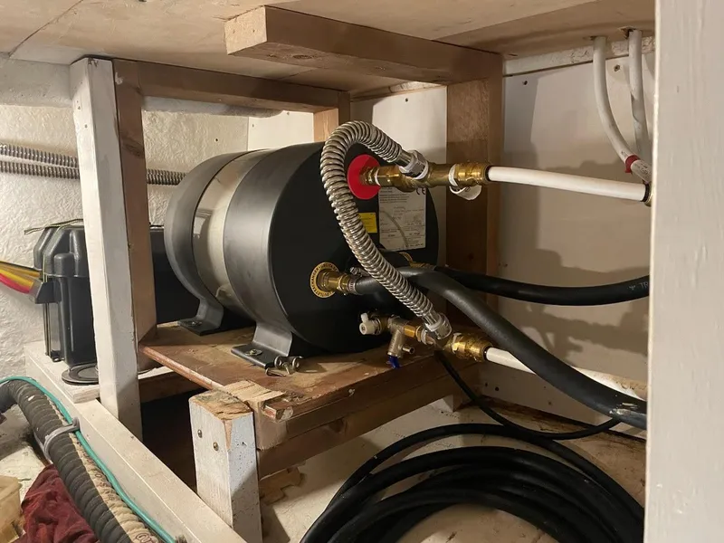 Slide: The Image of Engine room of a 2010 Custom Trawler with visible piping and equipment. - 23