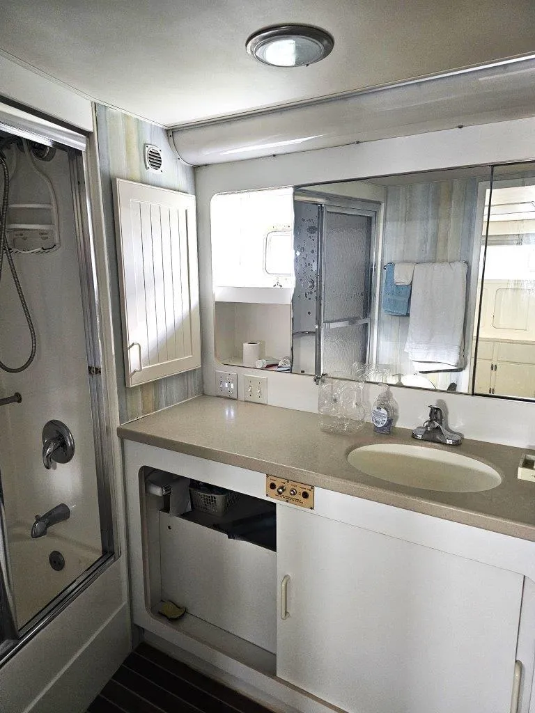 Slide: The Image of Bathroom interior of 1987 Hatteras 70 Cockpit Motor Yacht with shower and vanity. - 17