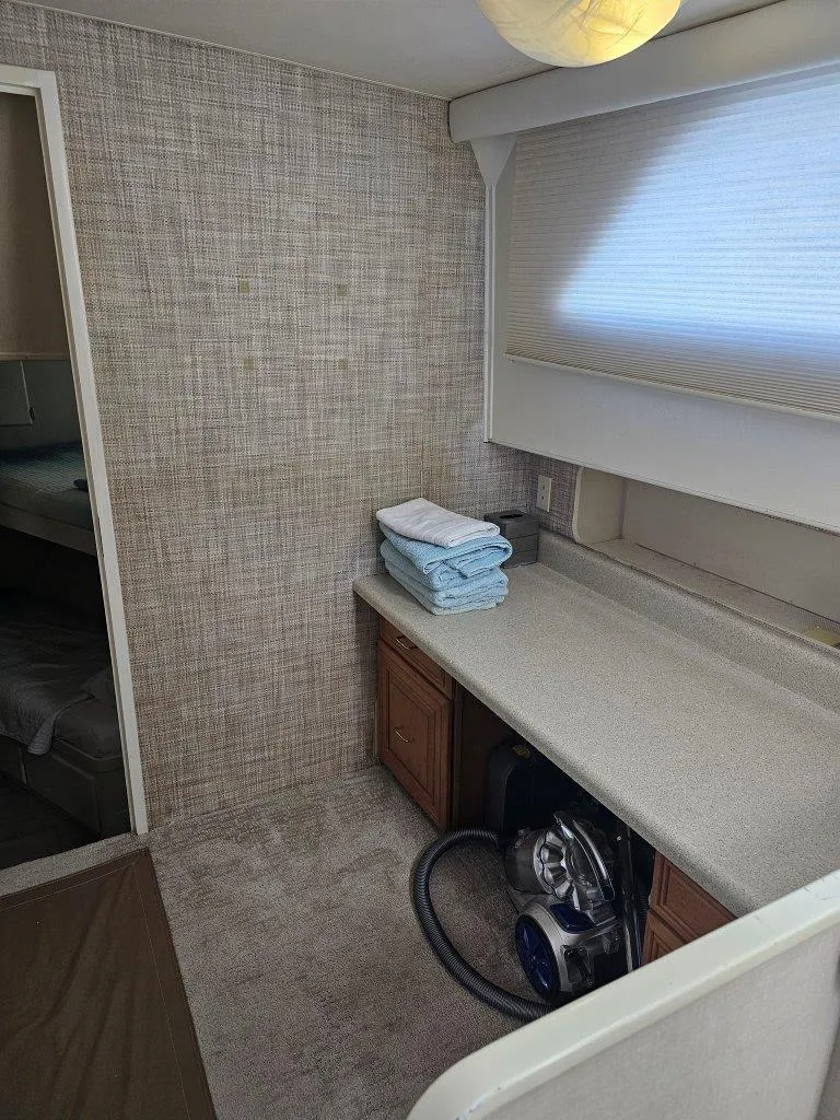 Slide: The Image of Interior of 1987 Hatteras 70 Cockpit Motor Yacht with countertop and storage. - 18