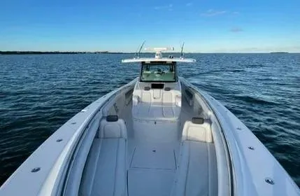 Slide: The Image of 2019 HCB 53 Sueños boat on open water under clear blue sky. - 14
